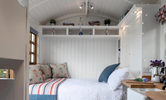 When the bed is folded down some extra shelves are revealed.